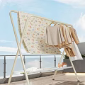 Clothes Rack On Balcony With Hanging Clothes Cartoon Patterned Cloth And Small Stuffed Toy