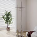 Freestanding Metal Clothes Hanger Indoor With Green Plant Window Blinds And Wooden Floor