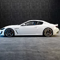 White Maserati Sports Car With Sleek Exterior Design And Alloy Wheels