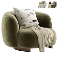 Olive Green Velvet Armchair With Decorative Pillow And Knitted Throw Blanket On Wooden Base