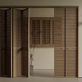 Wooden Louvered Folding Doors For Interior Space With Potted Plant And Wall Sconce