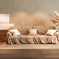 Two-Seater Beige Sofa With Slipcover Pillows Woven Rug And Pampas Grass Vase On Neutral Wall