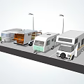 Different Types Of RVs Parked In Parking Lot With Street Lamps And Grass