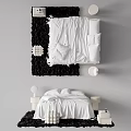 Elegant White Double Bed with Bedside Tables Round Lamps Black Rug and Decorative Spheres