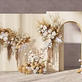 Floral Display Featuring Beige Background Hanging Dried Flowers White Blooms And Curved Arch Design