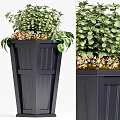 Stylish Black Garden Planter With Lush Green Plants And Orange Flowers