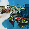 Amusement Park With Colorful Boats In Water Pool And Roller Coaster Near Blue Cabin