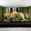 Elegant Banquet Hall Interior With Green Curtains Large Fan Decorations And Flower Arrangements