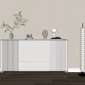 White Entryway Cabinet Sideboard With Modern Drawer Design And Decorative Vase Sculpture Pillar