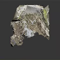 Rocky Coastal Terrain Featuring Cave Moss Covered Stone Walls Sandy Ground And Pebbles