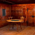 Vintage Wooden KTV Interior With Round Table Chairs And Wooden Walls
