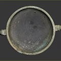 Ancient Bronze Vessel With Double Handles Intricate Carvings And Decorative Base