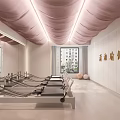 Clean Modern Fitness Studio Featuring Pink Wavy Ceiling Mirrors And Black Cushioned Chairs