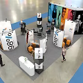 Modern Exhibition Booth Design With Modular White Orange Panels And Interactive Visitor Areas