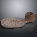 Ancient Rustic Metal Artifact With Irregular Shape And Textured Surface Displayed On Dark Reflective Background