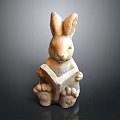 Rabbit Sculpture Holding a Book in Reading Position as Decorative Art Piece