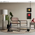 Stylish Leather Leisure Chair With Metal Frame Green Plant Floor Lamp And Wall Art On Rug