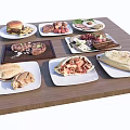 Assorted Delicious Food Plates Including Burger Steak Omelette Salad And Wraps On Wooden Table