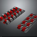 Red And Silver Capsule Blister Packs Medical Packaging On Dark Background
