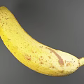 Ripe Yellow Banana with Brown Spots on Dark Background Showing Shiny Reflection