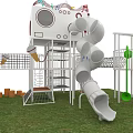 Multi Level Playground Equipment With Slides Climbing Frames Canopies And Rotating Components On Grass Lawn