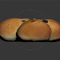 Golden Flower Shaped Raisin Bread With Shiny Crust On Black Background