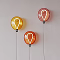 Colorful Round Wall Lamps With Bulb Shaped Design And Black Cords On White Background