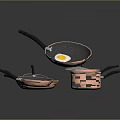 Copper Kitchen Cookware Set with Black Handles Stacked Frying Pans And Egg In Pan