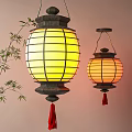 Hanging Yellow Lanterns With Black Frame Red Tassels And Bamboo Branches