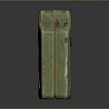 Vintage Green Jerry Can Featuring Yellow Label And Rusty Metal Surface