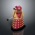 Red Metallic Robot Figure With Gold Spherical Bumps And Protruding Arm