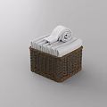 White Towels Folded And Rolled In Wicker Basket For Bathroom Storage