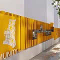 Modern HouBao Building Exterior With Yellow Facade Trees And Waterfront Seating Area