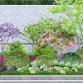 Beautiful Garden Flowers With Purple Pink Blooms Green Shrubs Stones And Small Plants On Grass