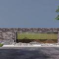 Stone and Metal Grille Feature Walls with Surrounding Rocks Trees and Pavement