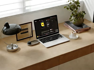 Laptop Setup On Wooden Desk With Desk Lamp Mouse Coffee Cup Potted Plant And Books 3d model