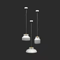 Three Modern Pendant Lights With Round Metal Shades For Interior Lighting Design