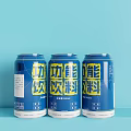 Three Blue Energy Drink Cans on Light Blue Background with Yellow Labels