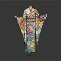 Traditional Japanese Kimono With Colorful Floral Patterns Displayed On Mannequin Stand