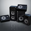 Black Audio Speakers Arranged In Various Sizes With Modern Design And High Sound Quality