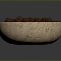 Natural Beige Stone Bowl Filled With Brown Nuts Against Dark Background