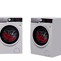 Two White Modern Washing Machines With Control Panel And Red Clothes Inside