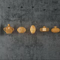 Various Woven Pendant Lights In Natural Color Hanging On Textured Gray Wall