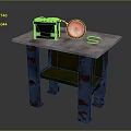 Worn Wooden Table With Blue Rusty Legs Black Box And White Round Object