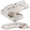 Modern Beige Sectional Sofa With Curved Design Soft Pillows And Throw Blanket