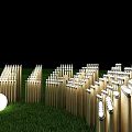 3D Letters Made of Wooden Sticks on Green Grass With White Spherical Lights