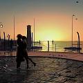 Sunset Coastal Landscape With Two People Walking Seagulls Flying Lighthouse And Street Lamps
