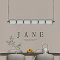 Modern Circular Chandelier Above Dining Table With Fruit Bowl Vase And Jane Wall Art
