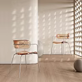 Modern Transparent Leisure Chairs With Metal Frame Against Light Shadow On Wooden Floor