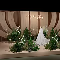 Elegant Wooden Sculpted Wedding Scene With White Dress Green Plants And Flowers